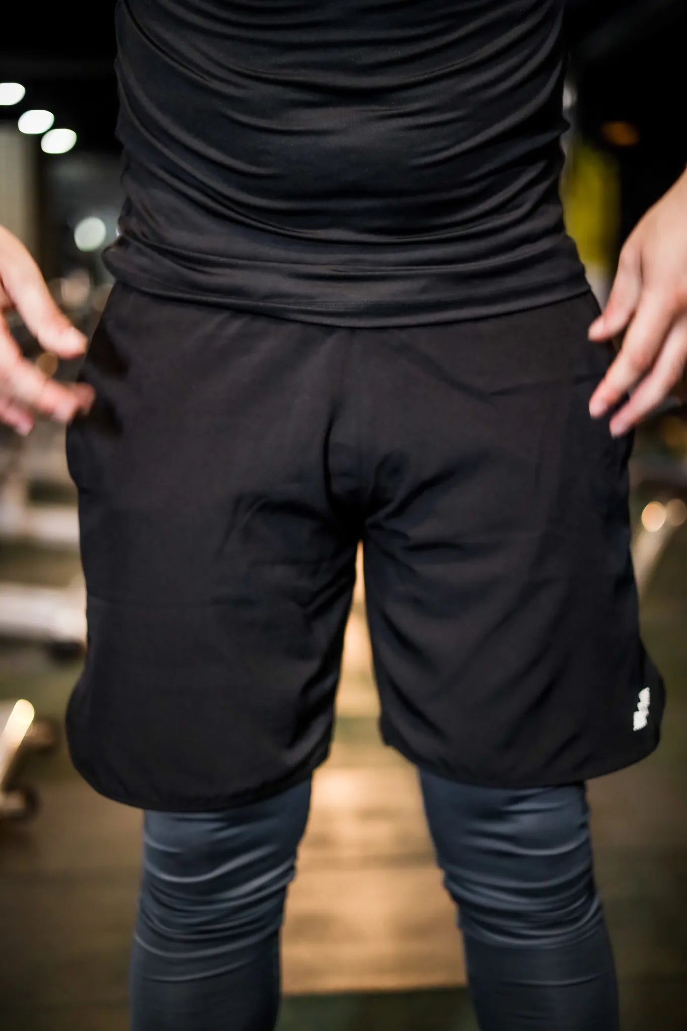Close-up view of men's compression shorts in black, offering snug fit and muscle support