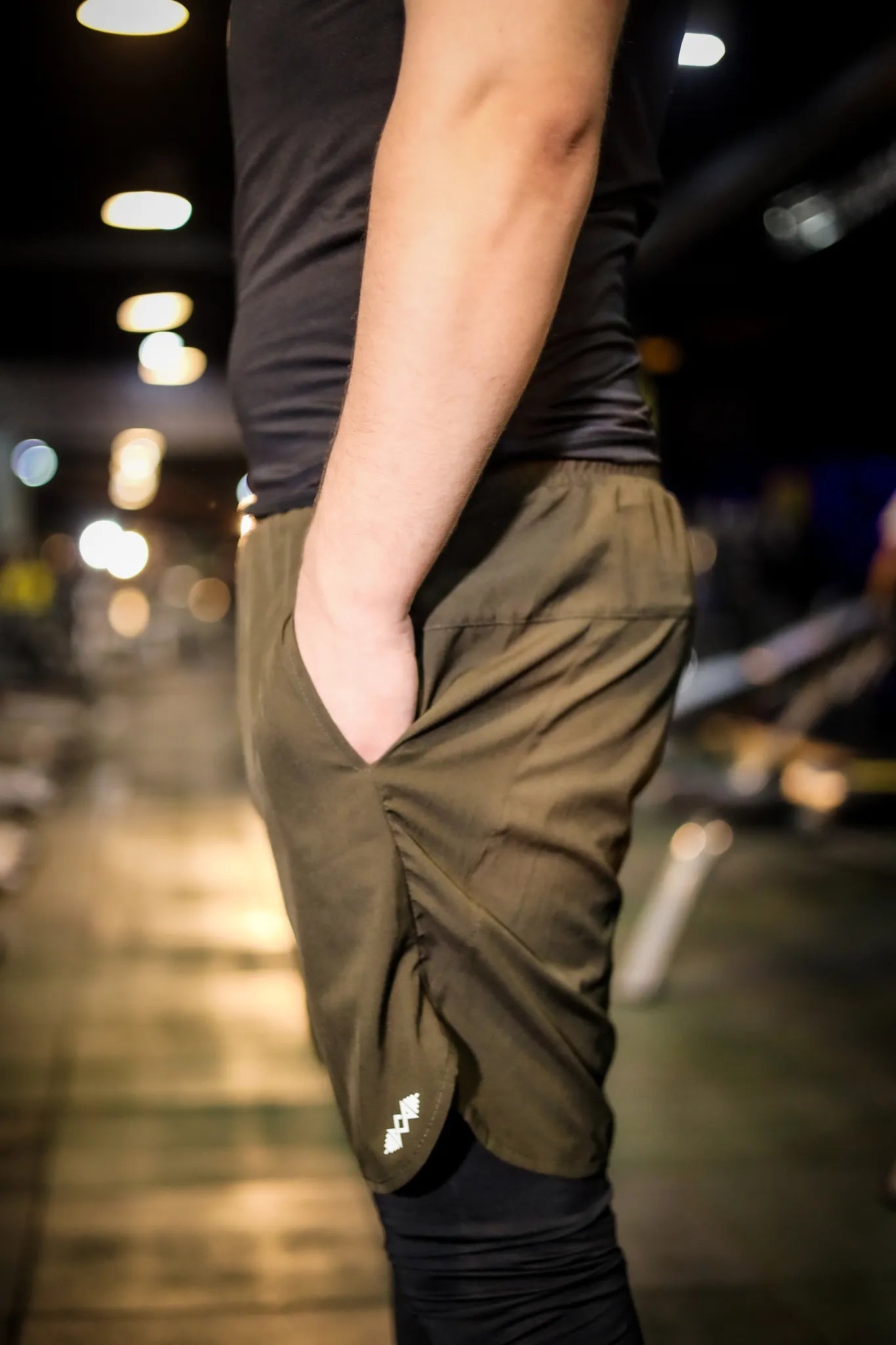Side view of men's compression shorts in olive green, offering excellent support and comfort