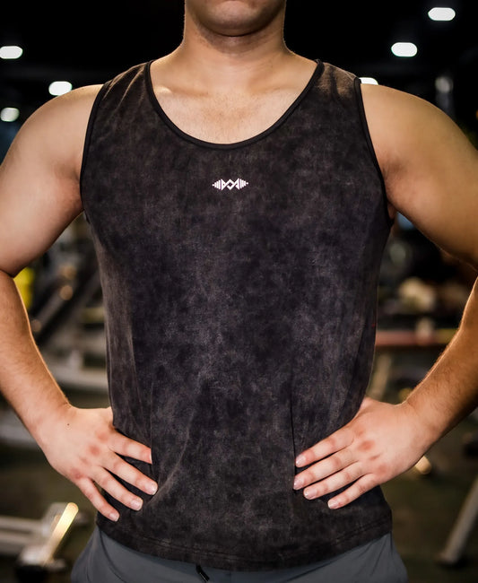Close-up view of men's compression tank top in dark black, providing optimal muscle support