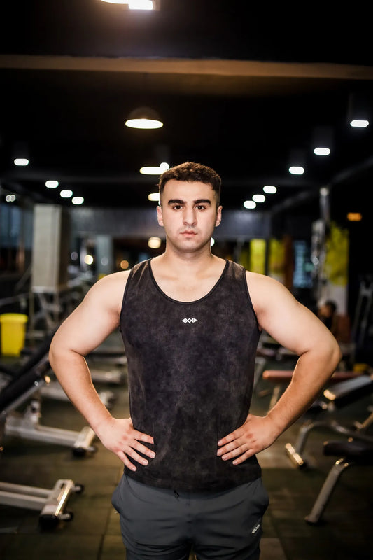 Full view of men's compression tank top in dark black, perfect for intense workouts and sports activities.