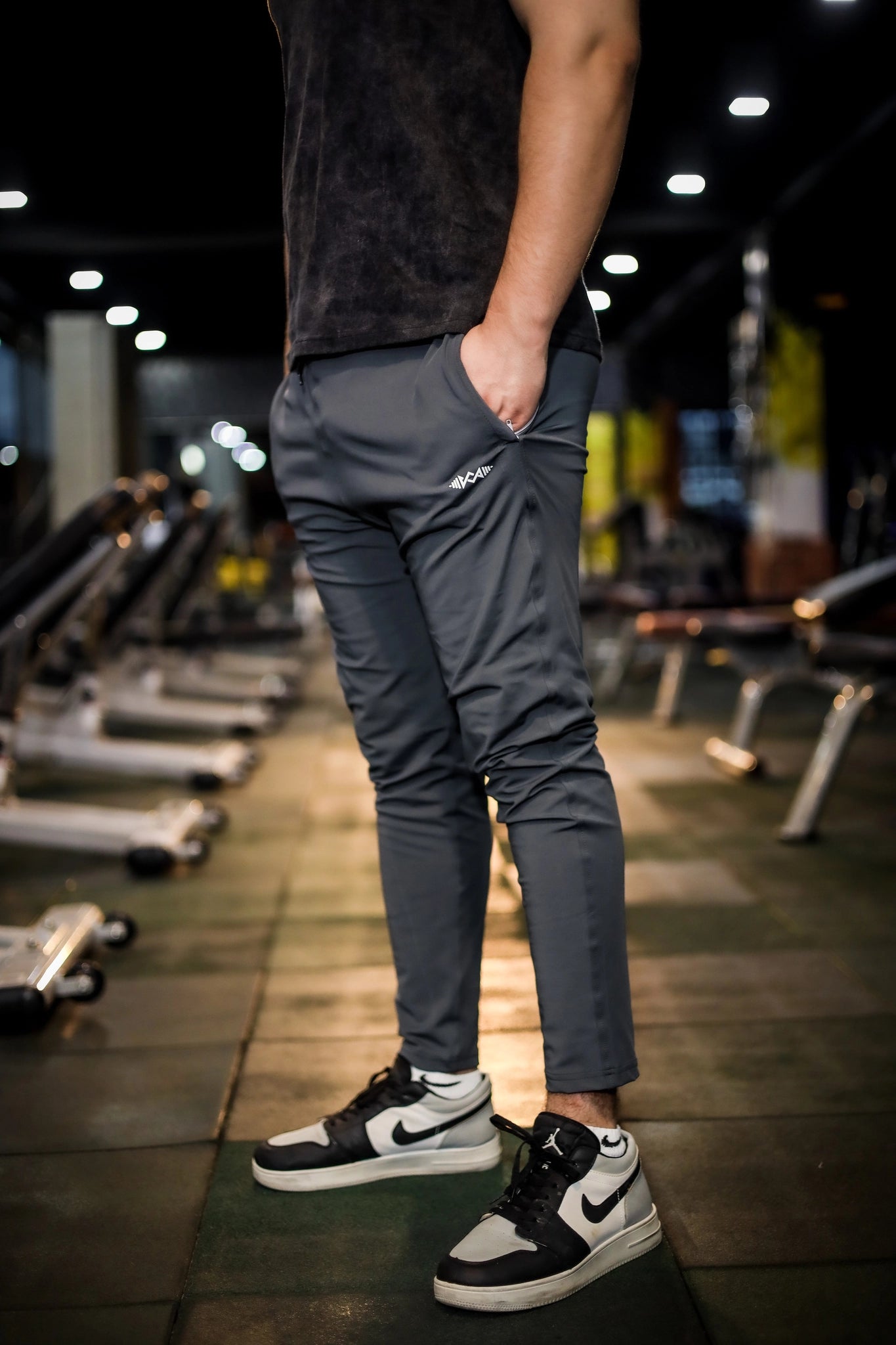 Full view of men's gray stretch fit trousers showing the complete design from top to bottom