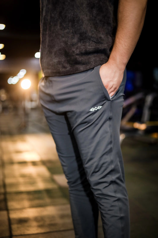 Side view of men's gray stretch fit trousers showcasing the sleek, modern fit