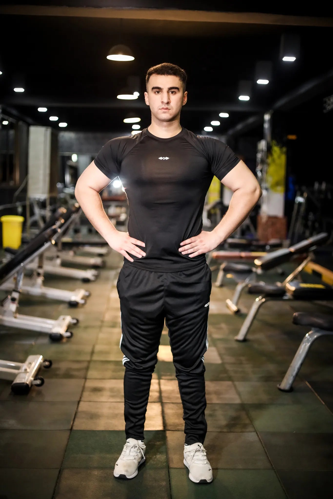 Model wearing men's gray trouser in a casual setting, showcasing versatility for any occasion