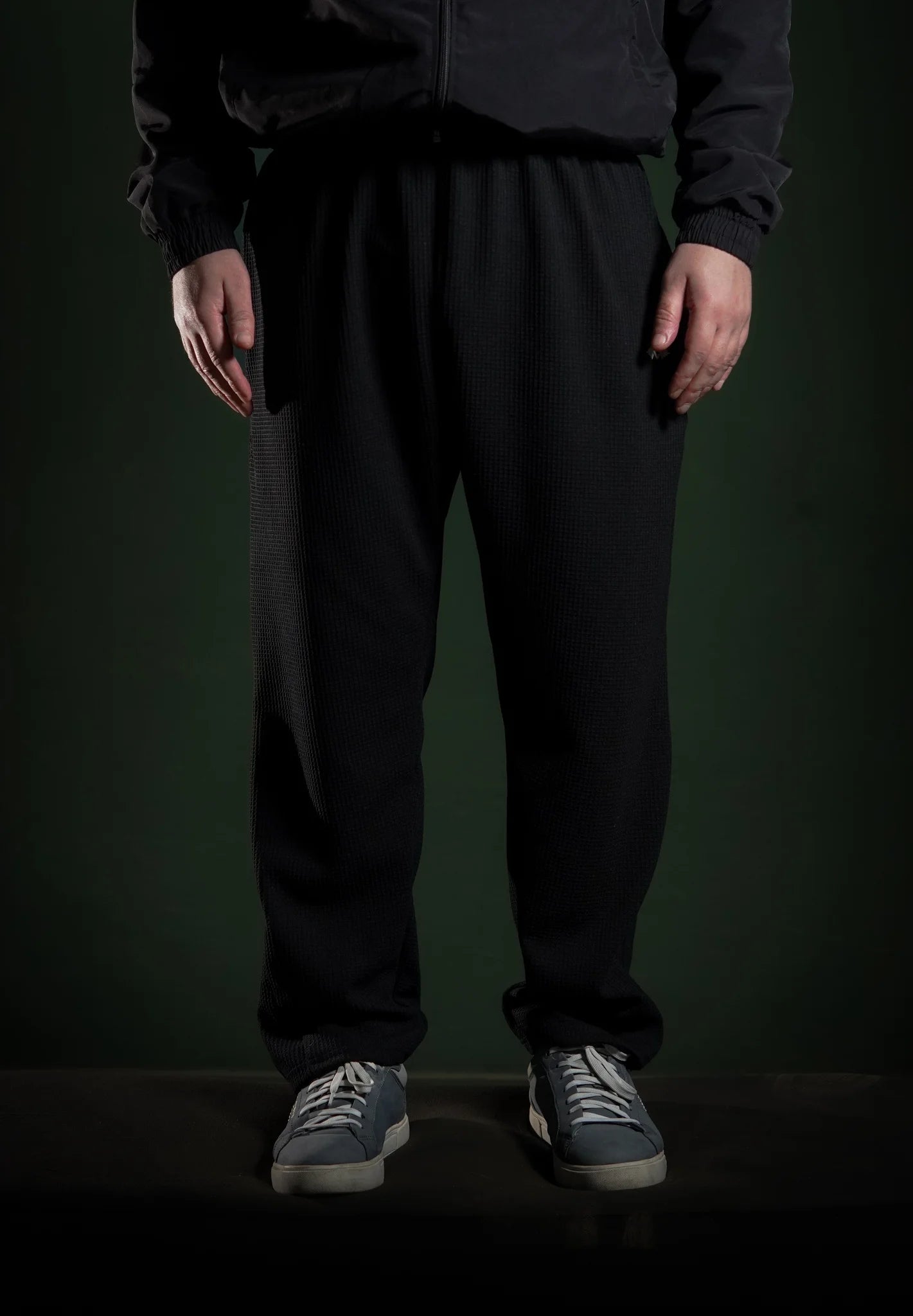 Men’s loose bottom trousers Black front view. Comfortable, stylish, and modern fit