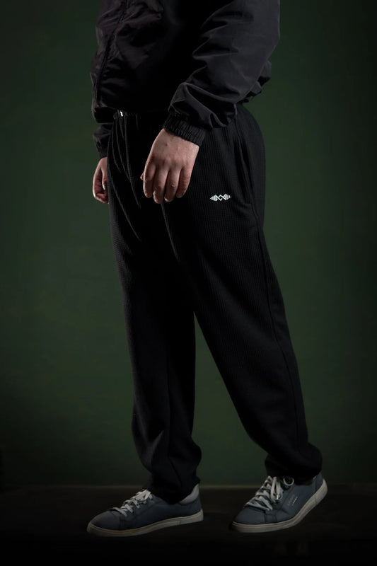 Men’s loose bottom trousers Black side view. Perfect for casual wear and street style