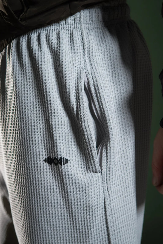 Men’s loose bottom trousers  Light Grey, side view. Perfect for casual wear and street style