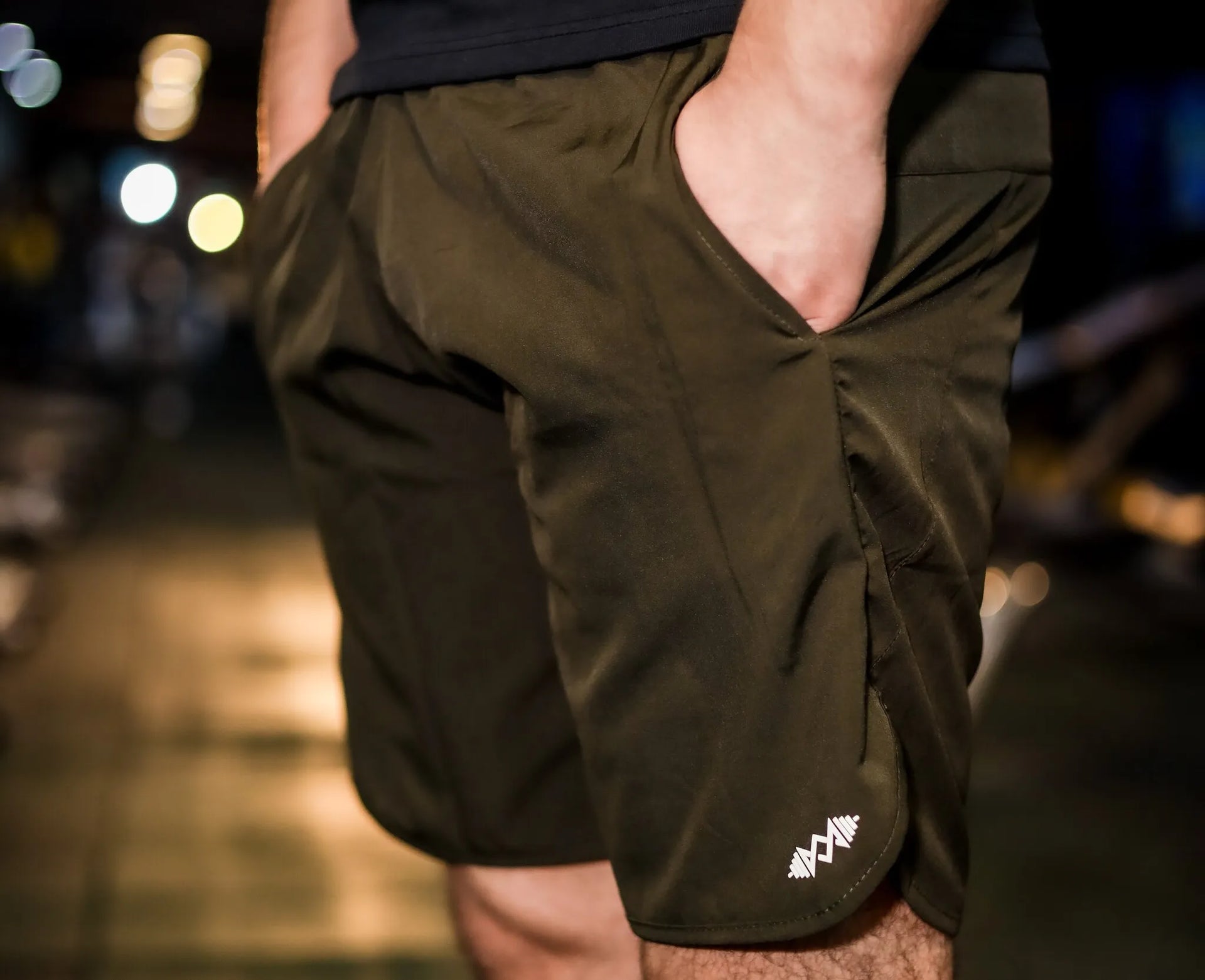 Close-up of the soft, breathable fabric of men's olive green  sport shorts, ideal for active wear