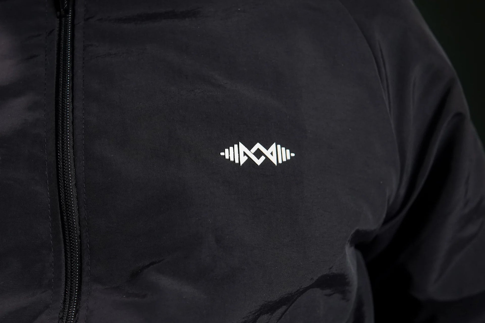 Men’s windbreaker jacket  Black close-up. Soft fabric and modern design