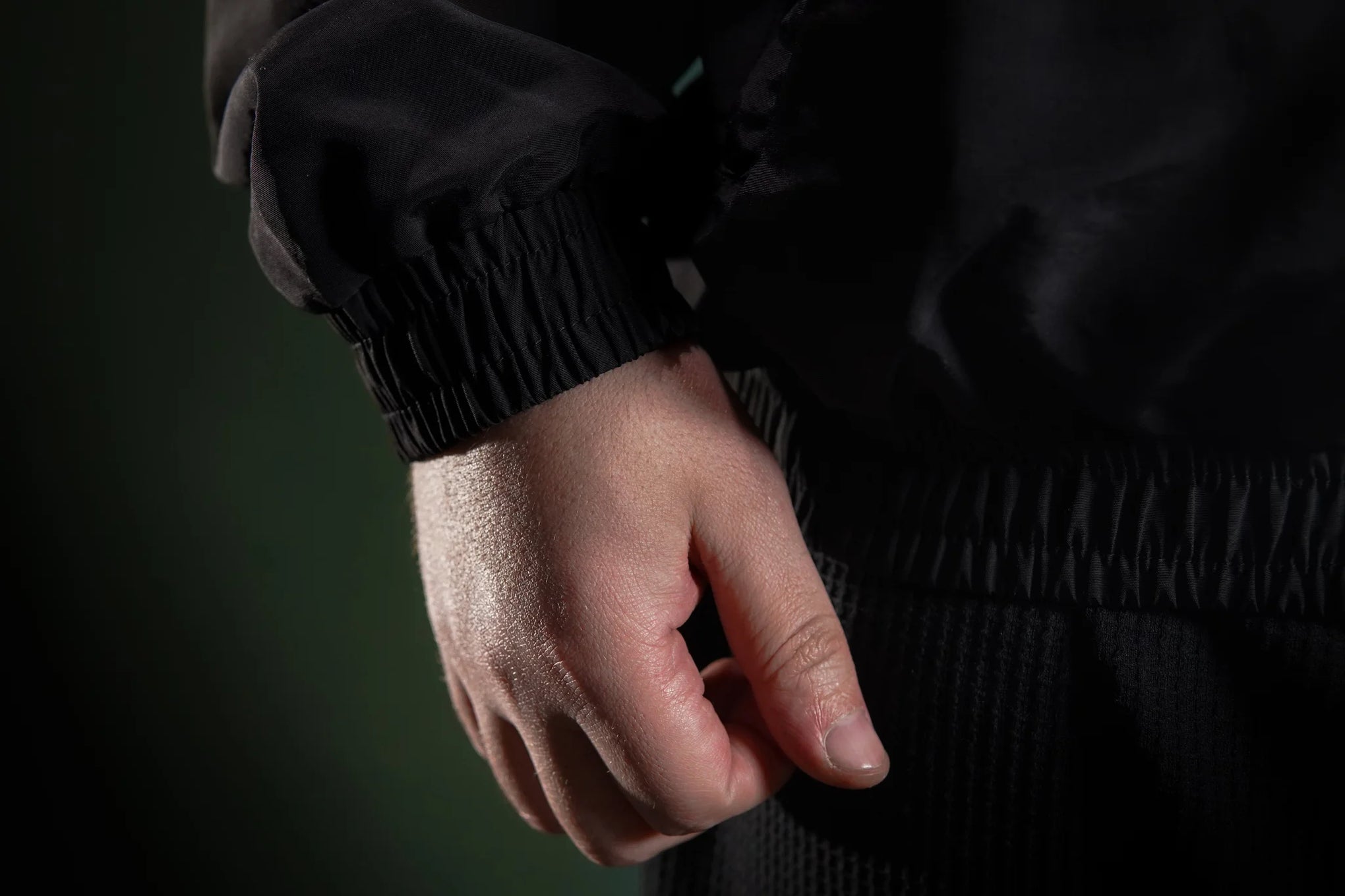 Men’s windbreaker jacket  Black detailed view of fabric texture and stitching