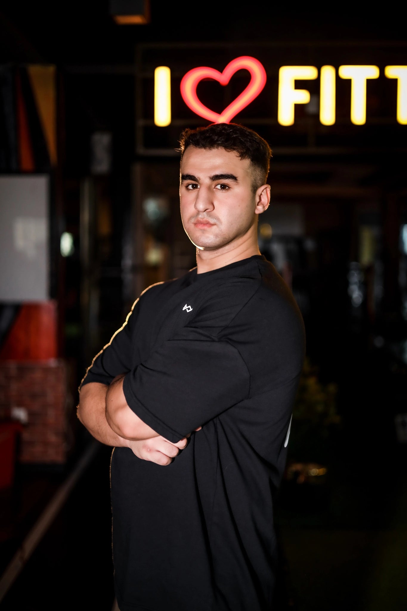 Side view of Murks Drop Shoulder Dripping T-shirt in black offering a relaxed fit and modern design