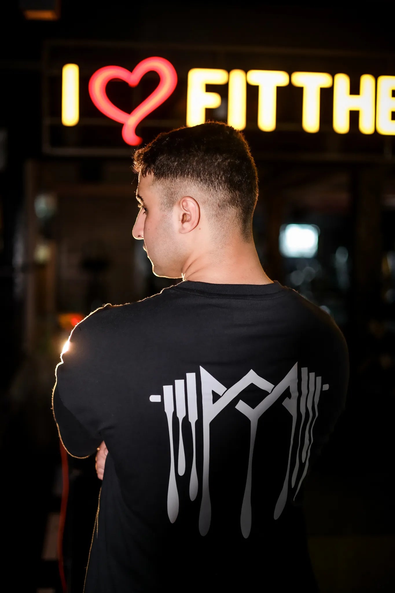 Back view of Murks Drop Shoulder Dripping T-shirt in black  highlighting the bold dripping details