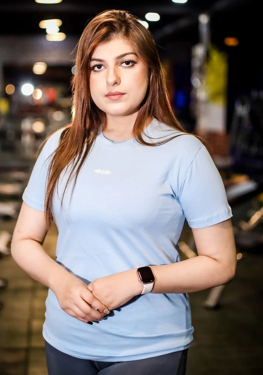 Front view of women’s model wearing a simple blue T-shirt, perfect for casual and stylish wear.