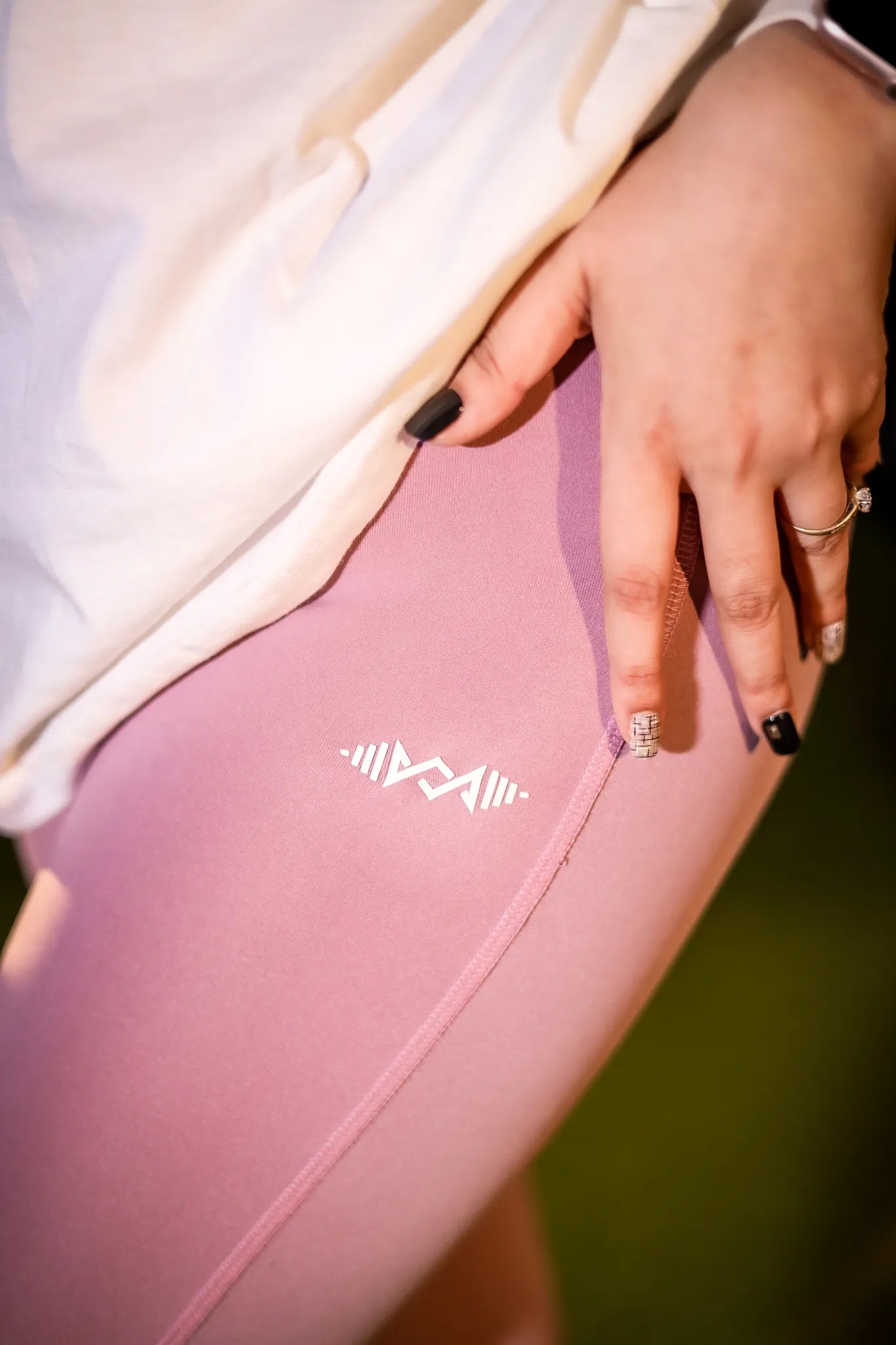 Close-up of the soft and stretchy fabric of women’s leggings, pink color offering comfort and breathability