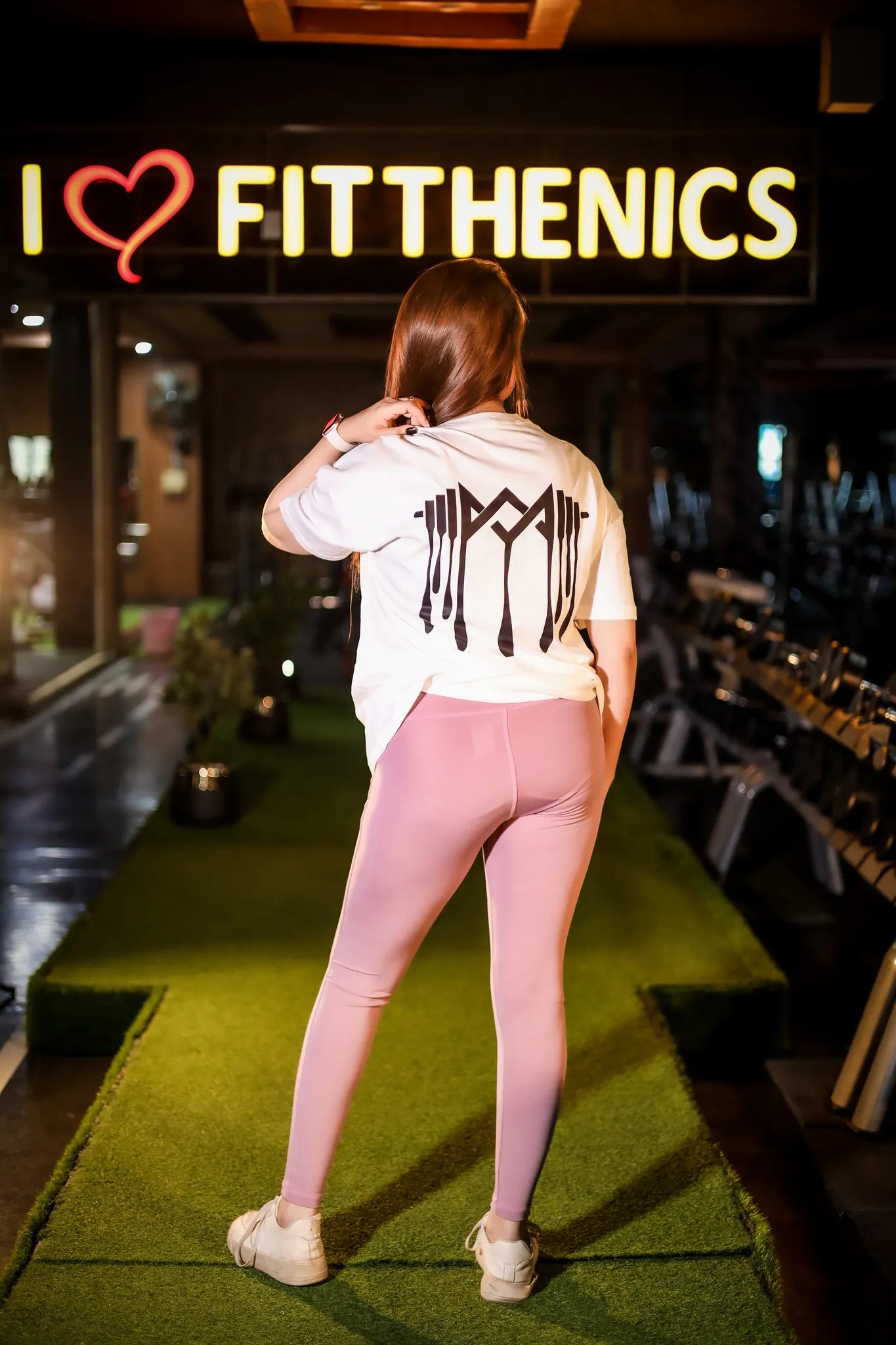 Back view of women’s leggings, pink color designed  for a flattering and sleek look